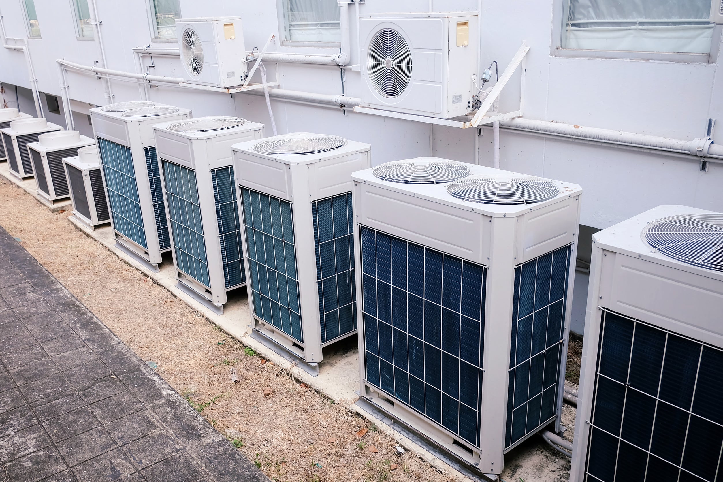 a row of commercial air conditioning units
